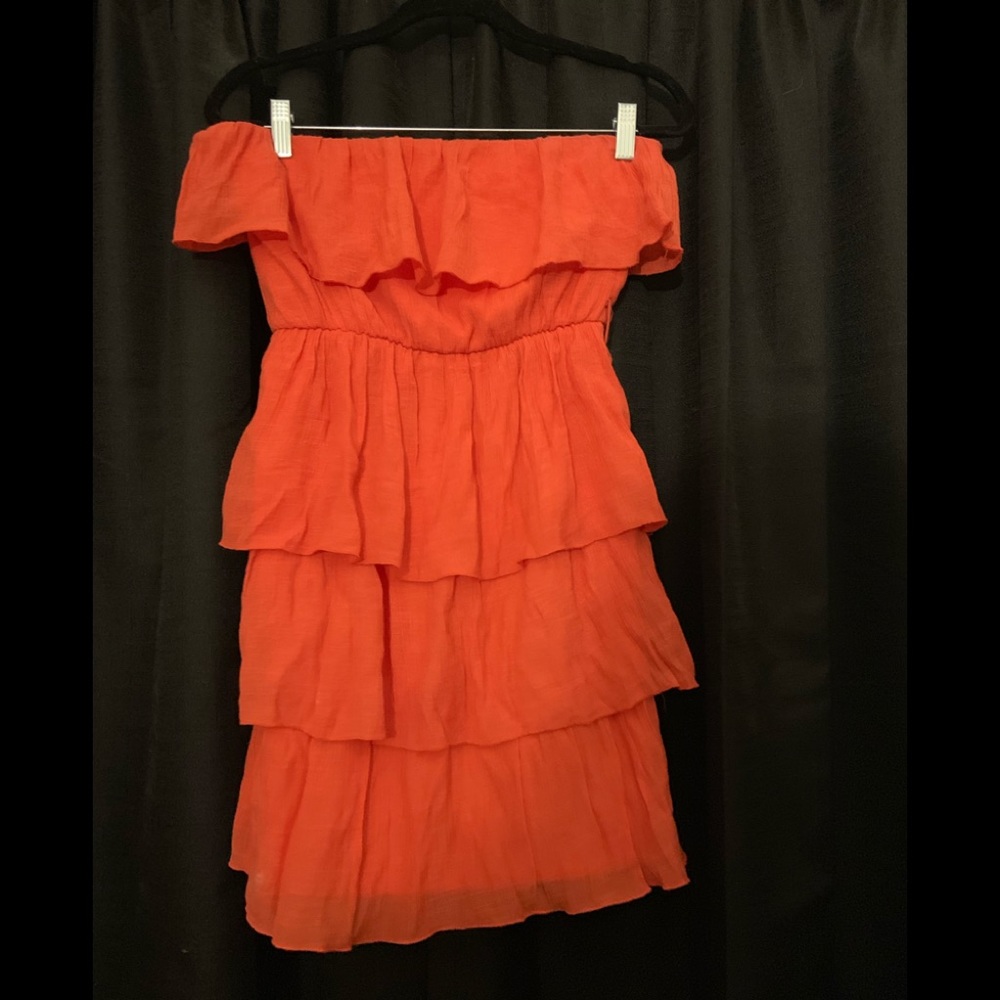 Sleeveless orange ruffle dress